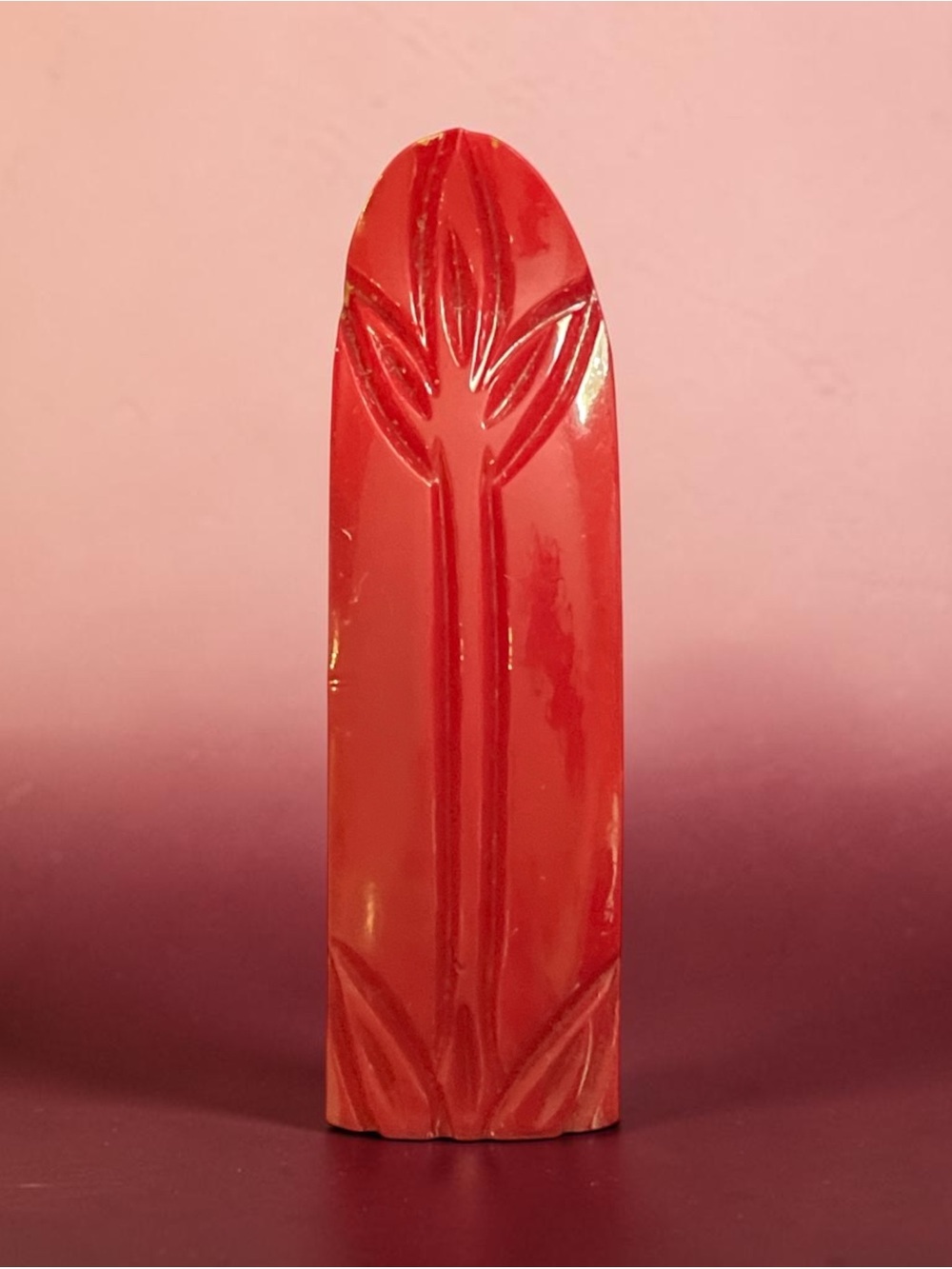 Bakelite dress clip, cherry red carved Art Deco circa 1930s–1940s